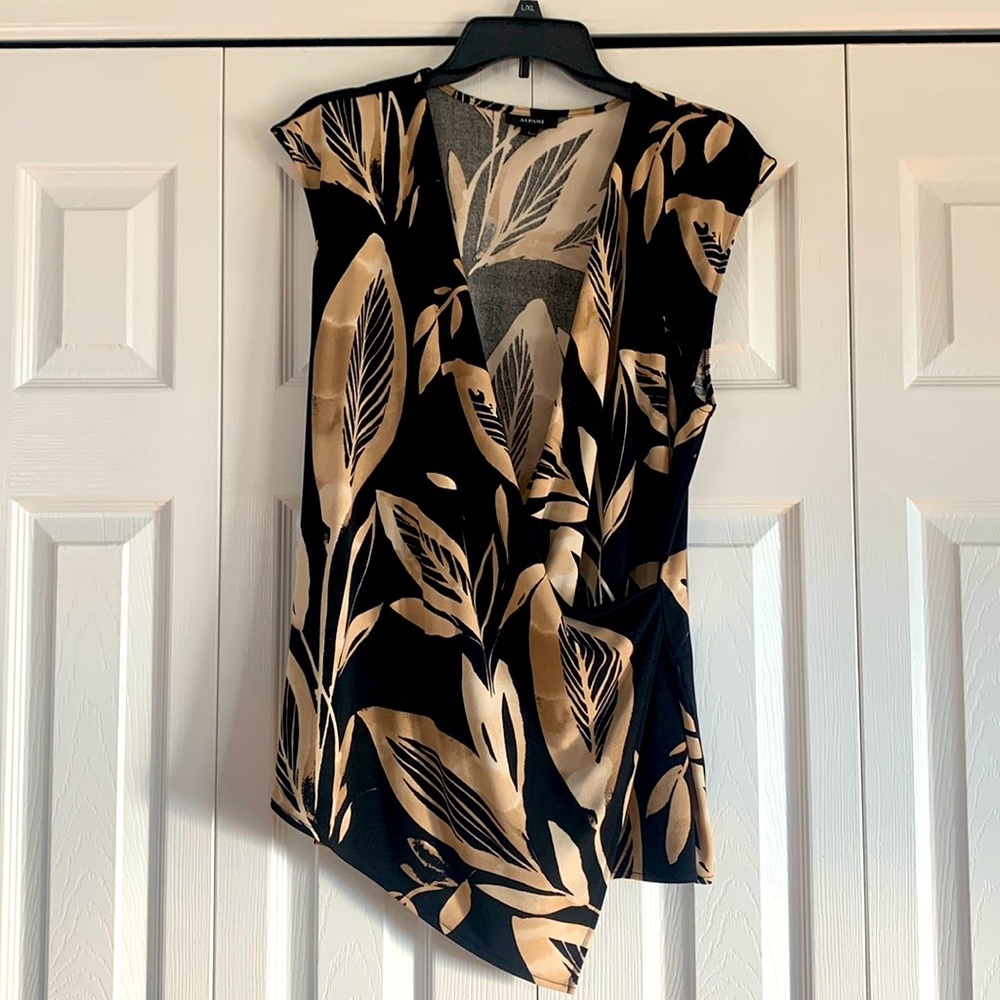 Light new beautiful black and tan low cut blouse.